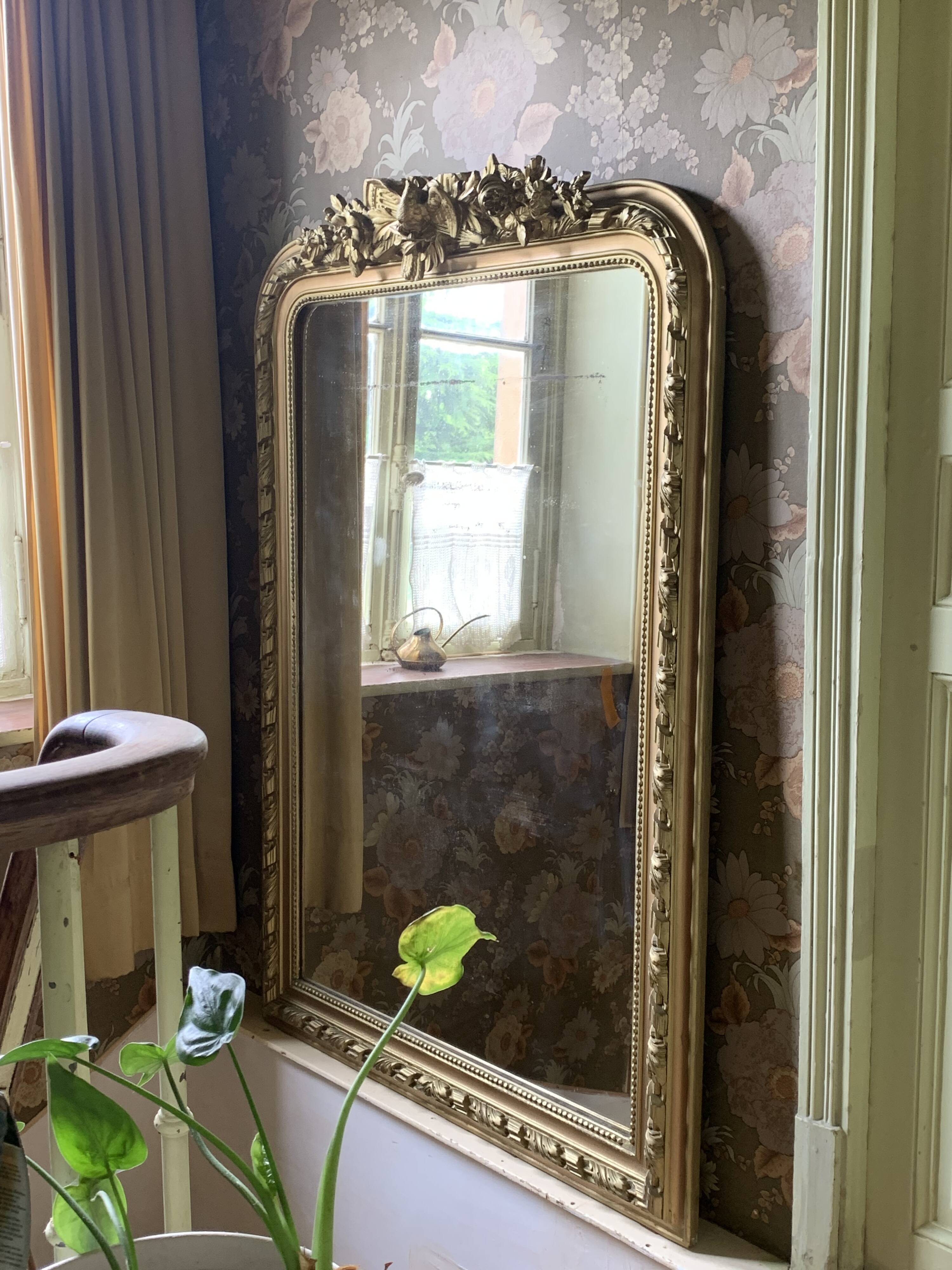 Gilded wooden fireplace mirror with pediment