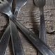 Mismatched set of 8 forks + 8 vintage shell stainless steel knives