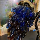 Table lamp with four light arms, grape cluster-shaped globes