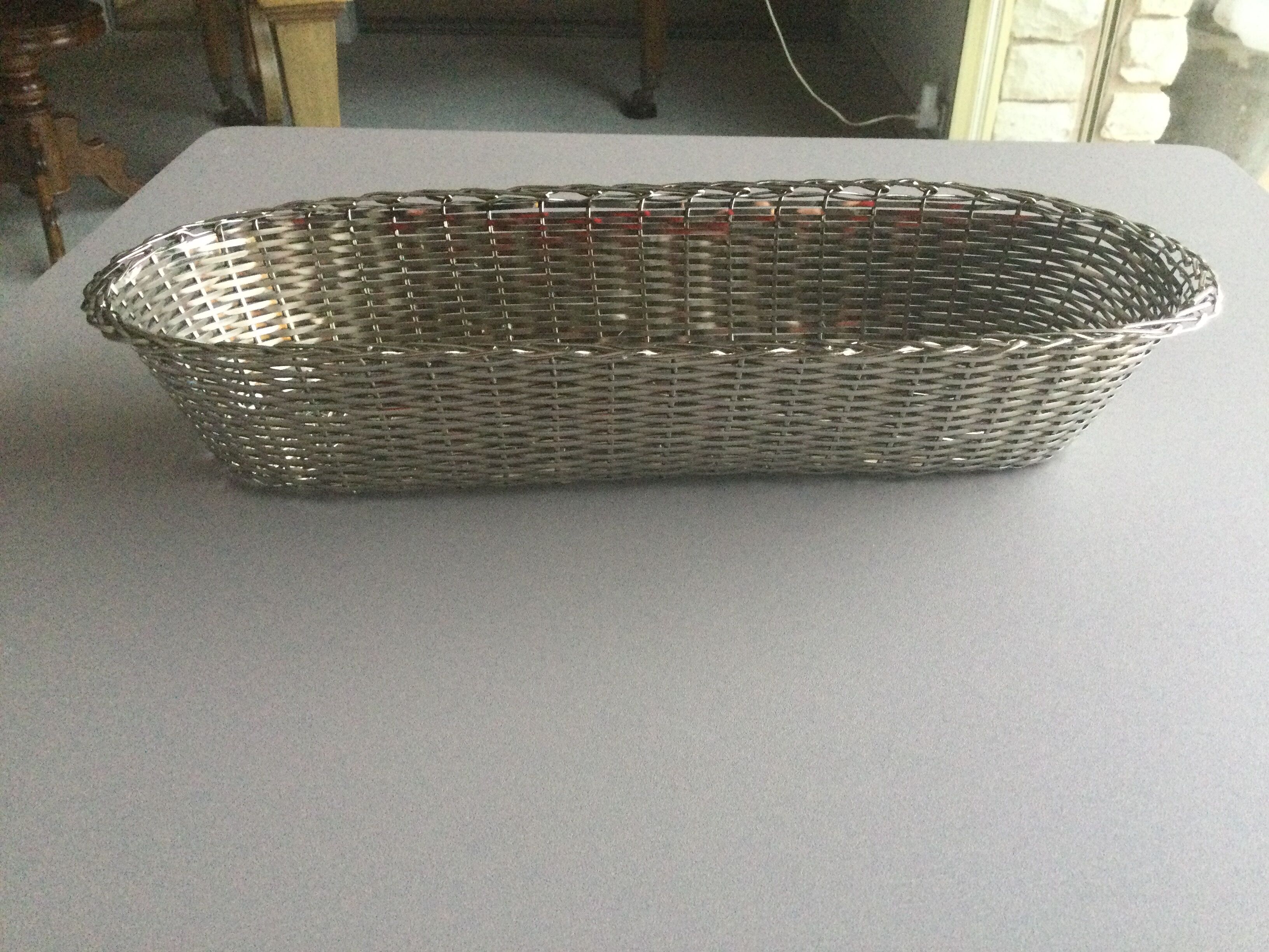 Braided silver metal bread basket