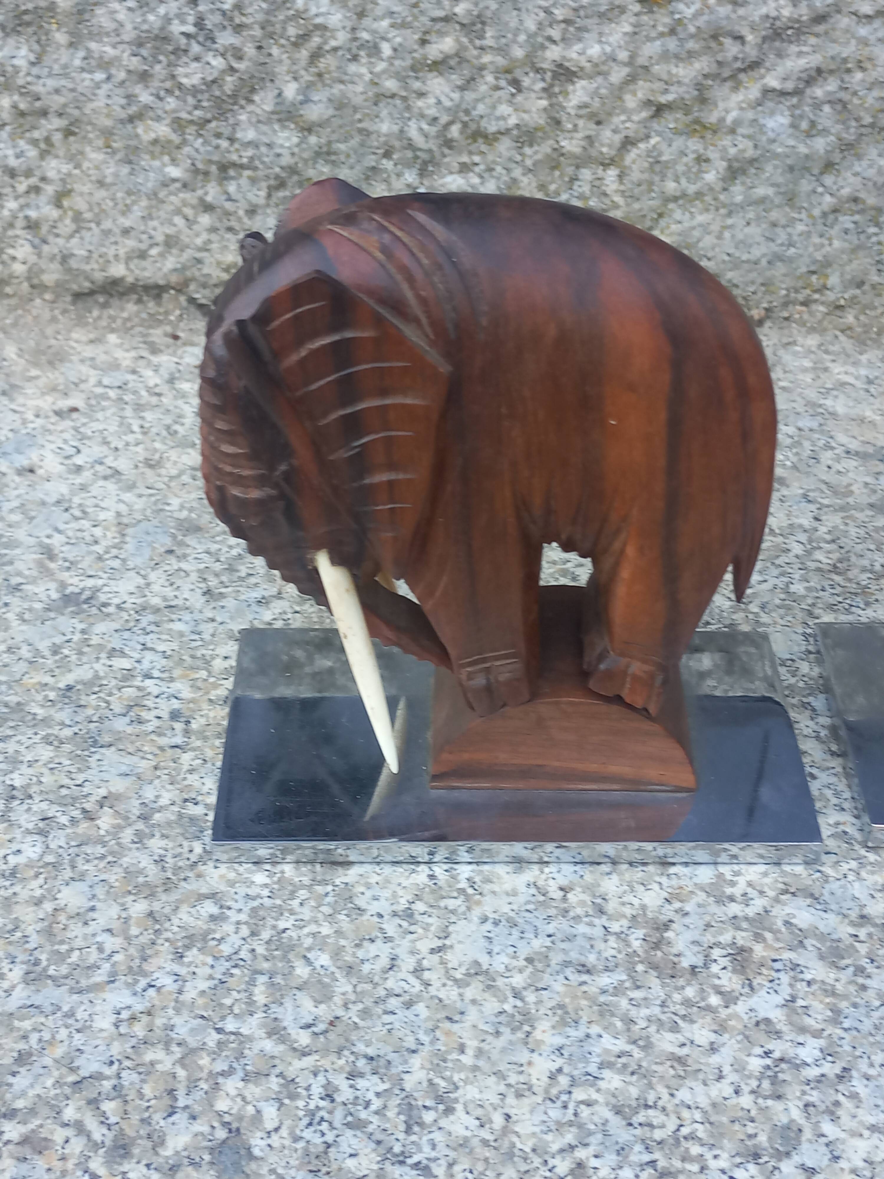 Pair of Art Deco elephant bookends in rosewood with chrome base.