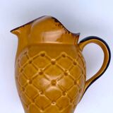 Yellow and brown ceramic pitcher