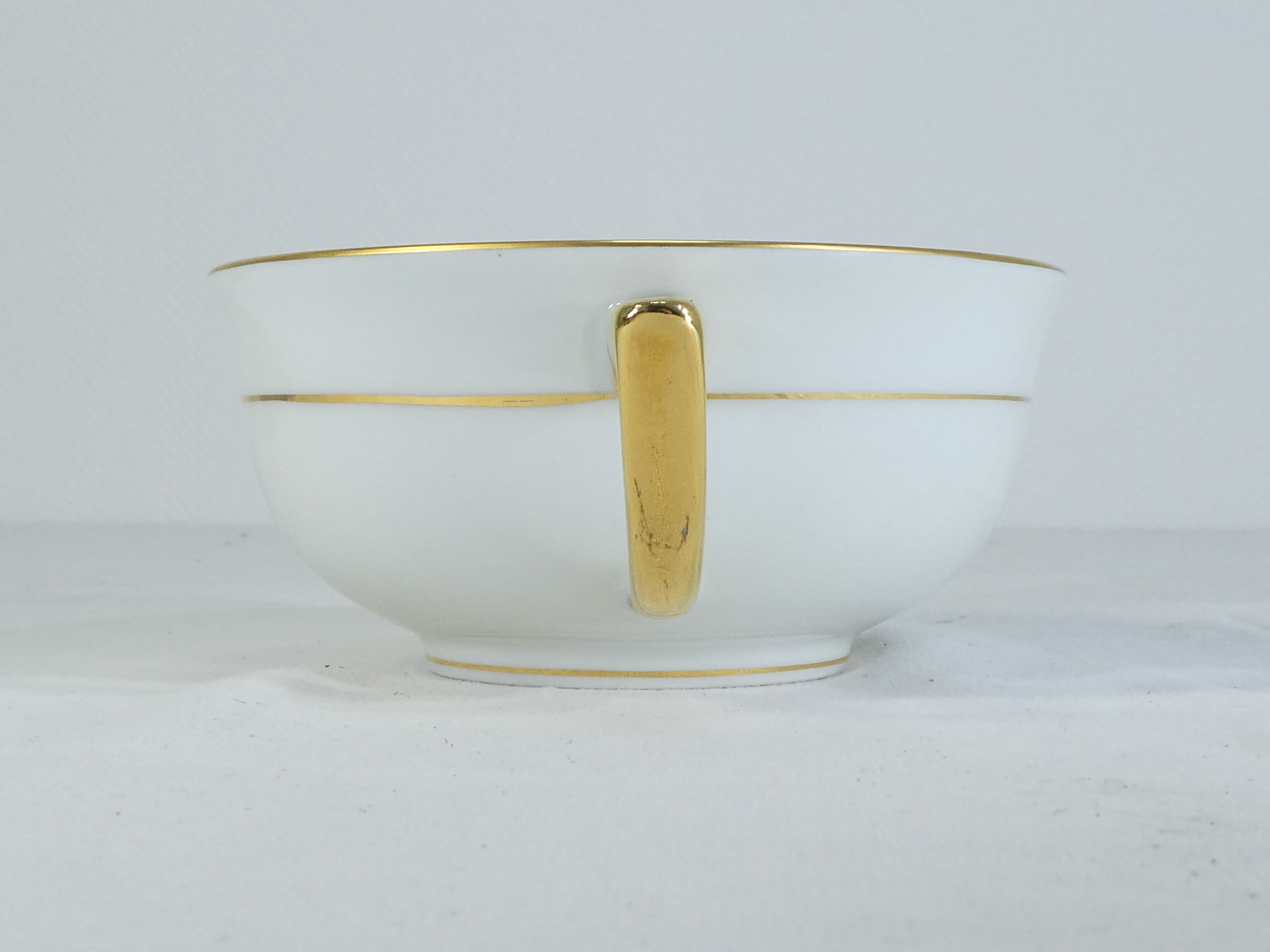 Green and gilded LIMOGES porcelain cup and cup lunch