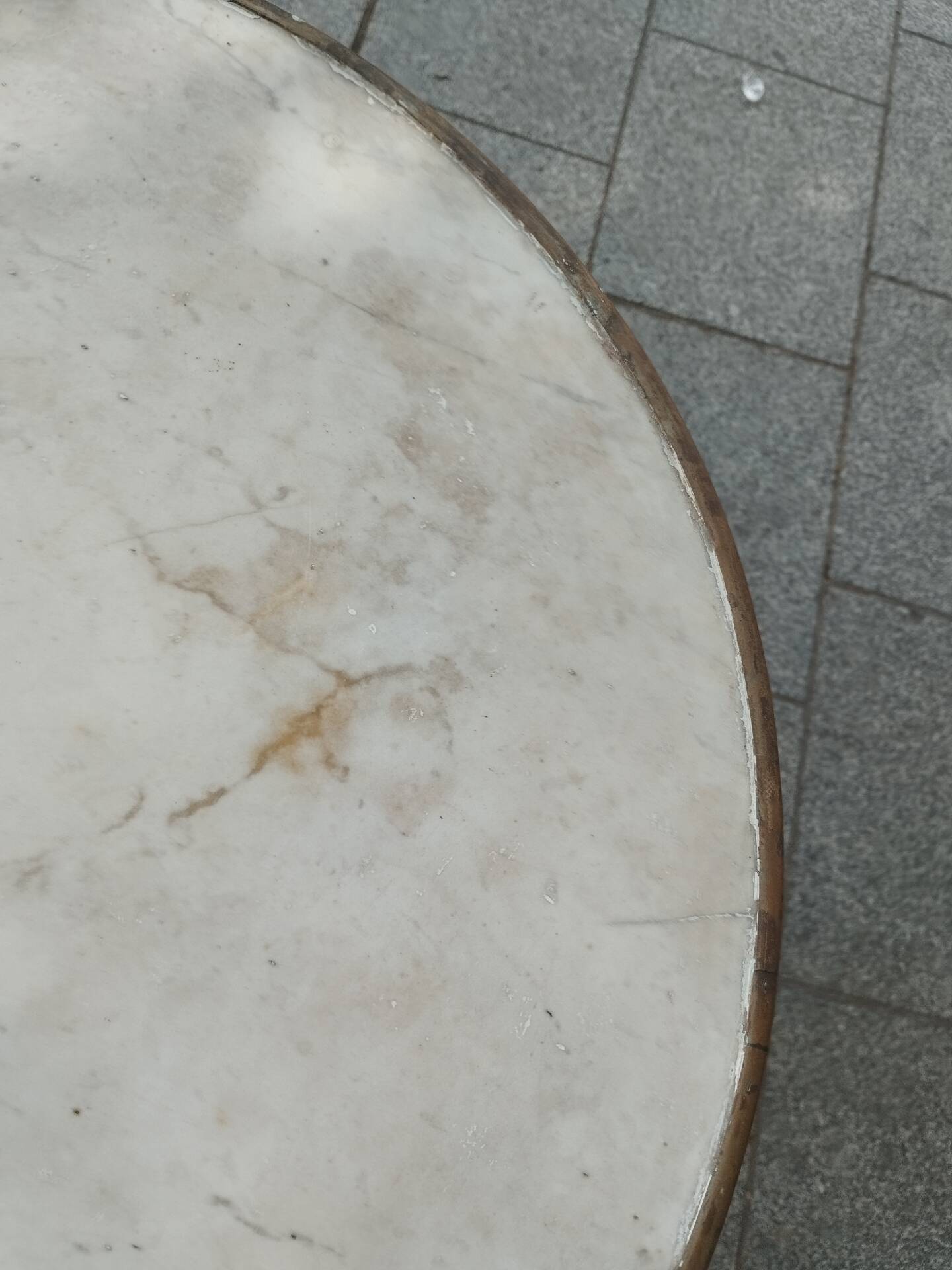 Old bistro table with marble top and cast iron base.