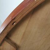 Round coffee table in walnut veneer and metal