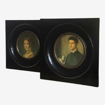 Two vintage round frame portraits