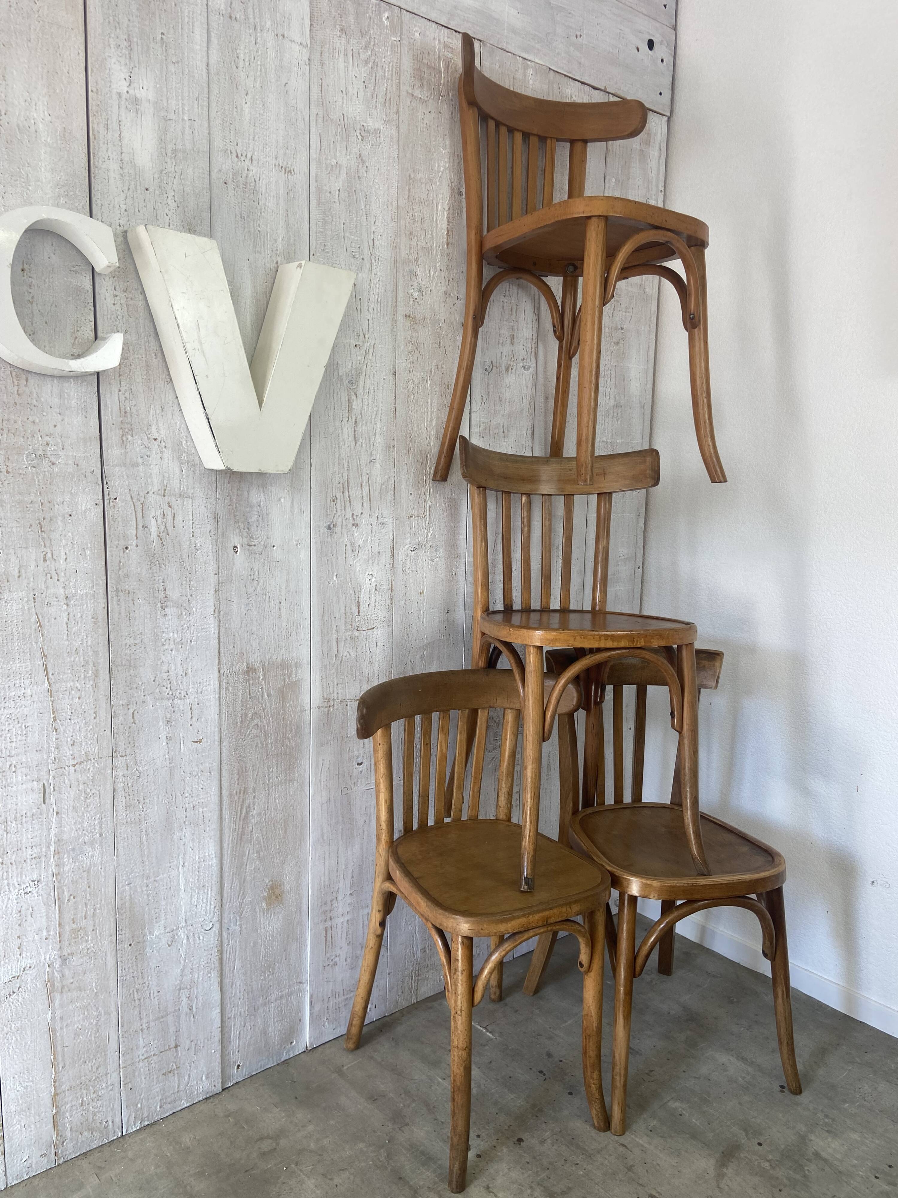 Mismatched curved wood bistro chairs (Fischel..)