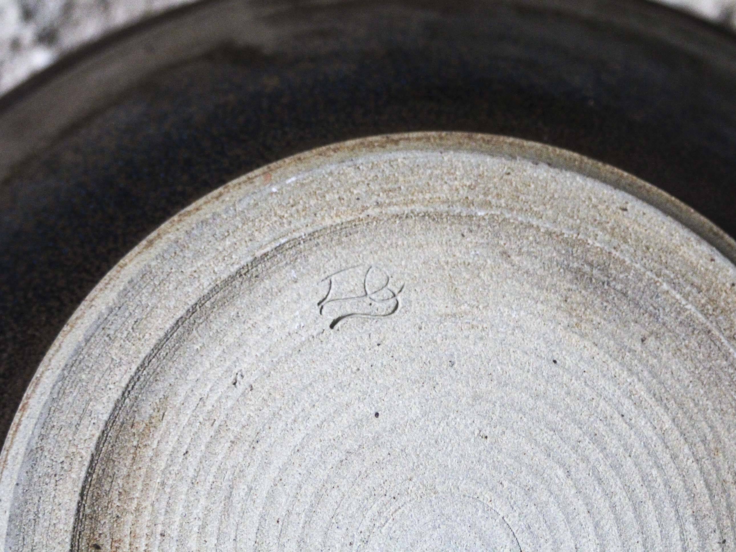 Enamelled ceramic hollow dish signed