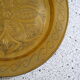 Oriental style chiseled metal plate