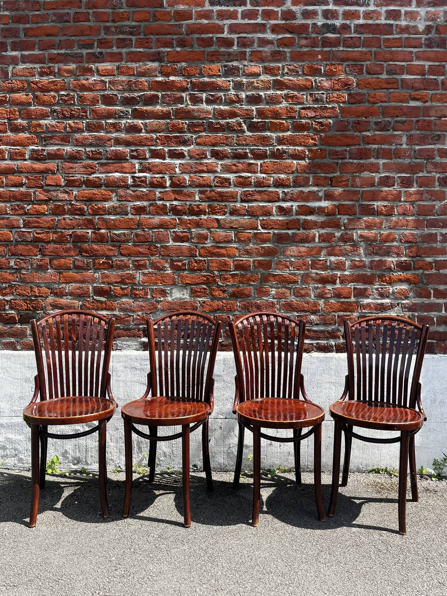 Lot of 4 vintage bistro chairs with slats in Thonet style.