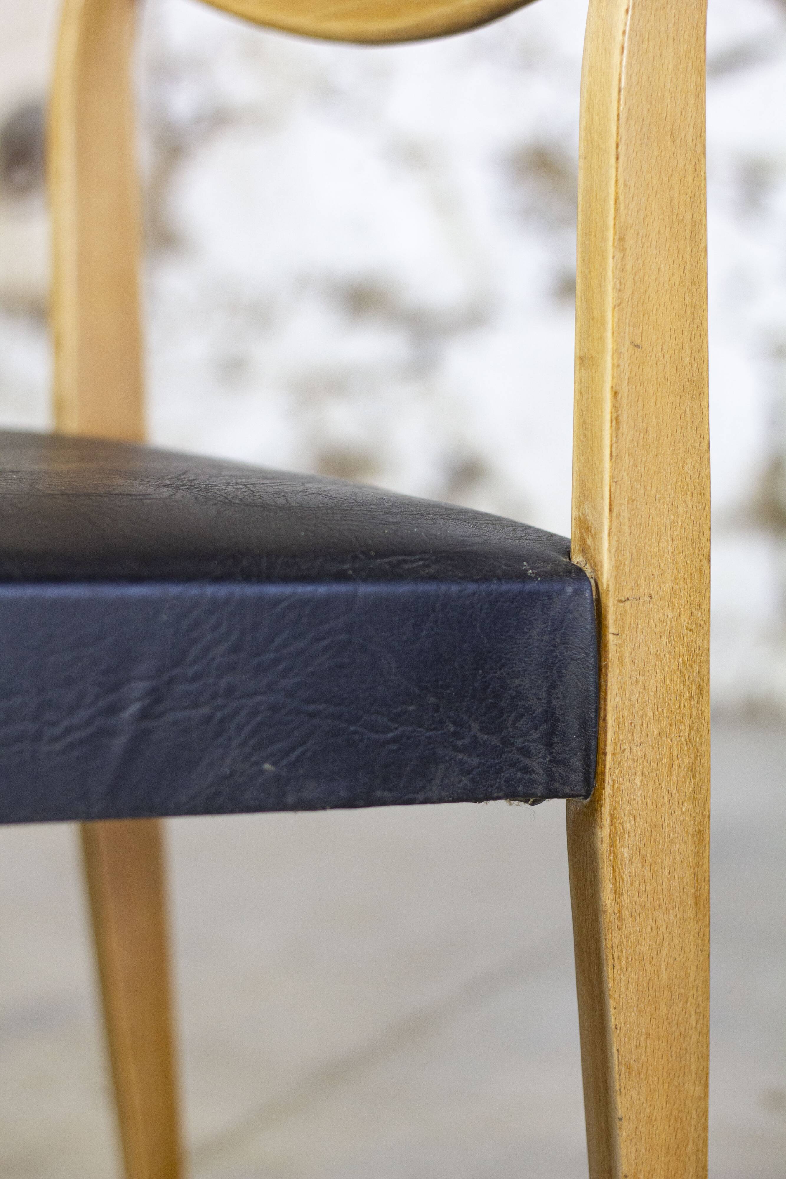 Scandinavian chair in teak and faux leather, 1960.