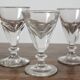 4 antique stemmed wine glasses with flat sides, made of blown glass from the 19th century