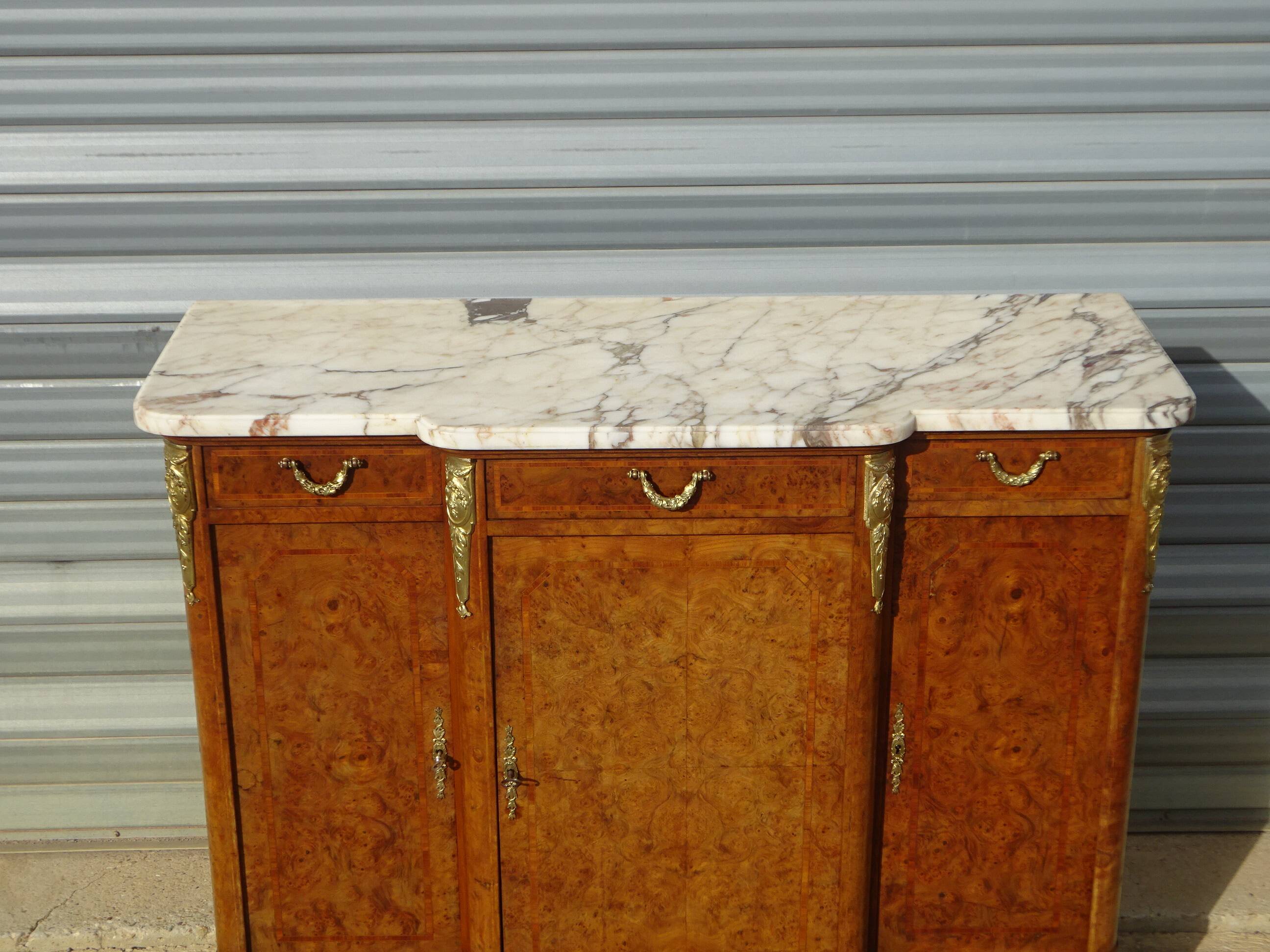 Louis XVI style walnut burl buffet with gilt bronze mounts