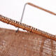 Vintage wicker chair with armrests from the 1960s
