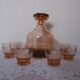 Pink glass liqueur carafe and 6 matching glasses