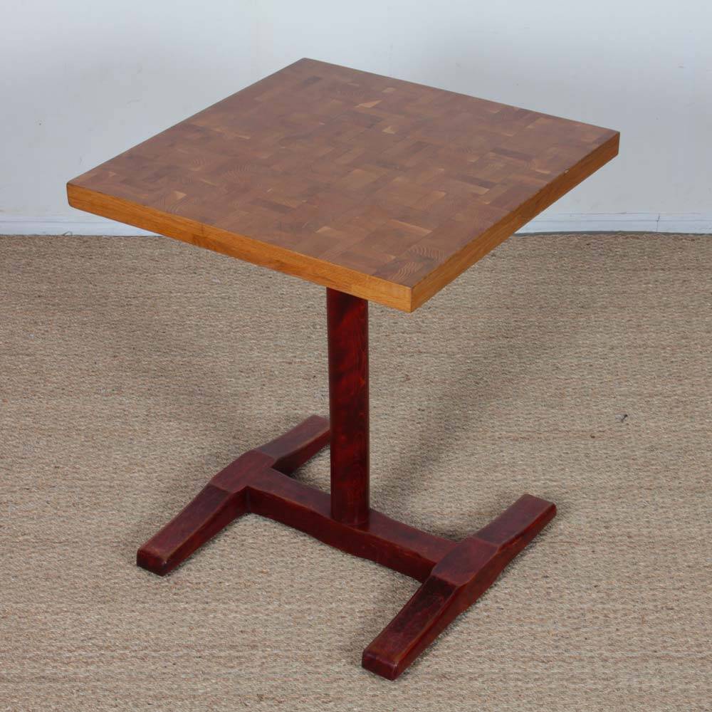 Square wooden dining table with a pedestal from the 1980s.