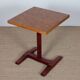 Square wooden dining table with a pedestal from the 1980s.