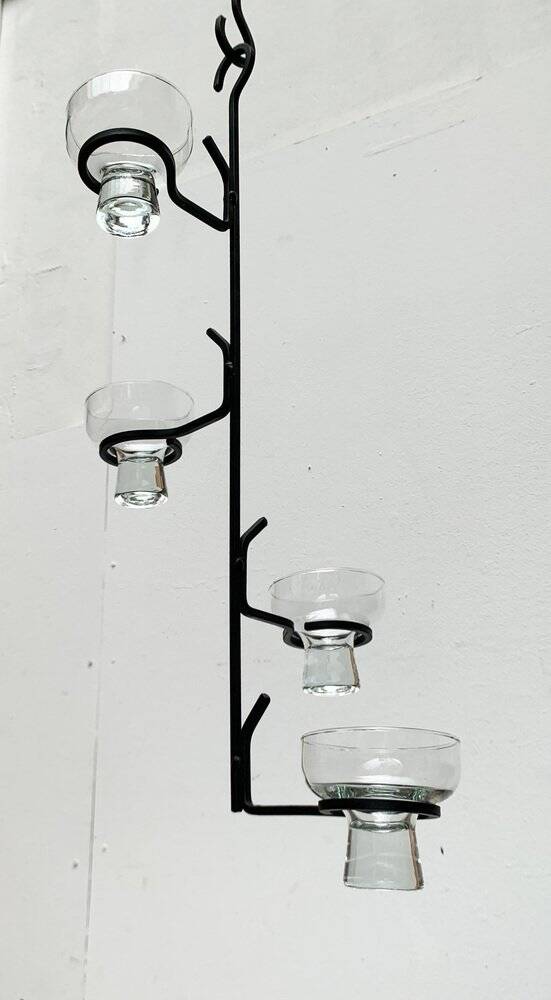 Mid-century metal and glass pendant light from the 1960s.