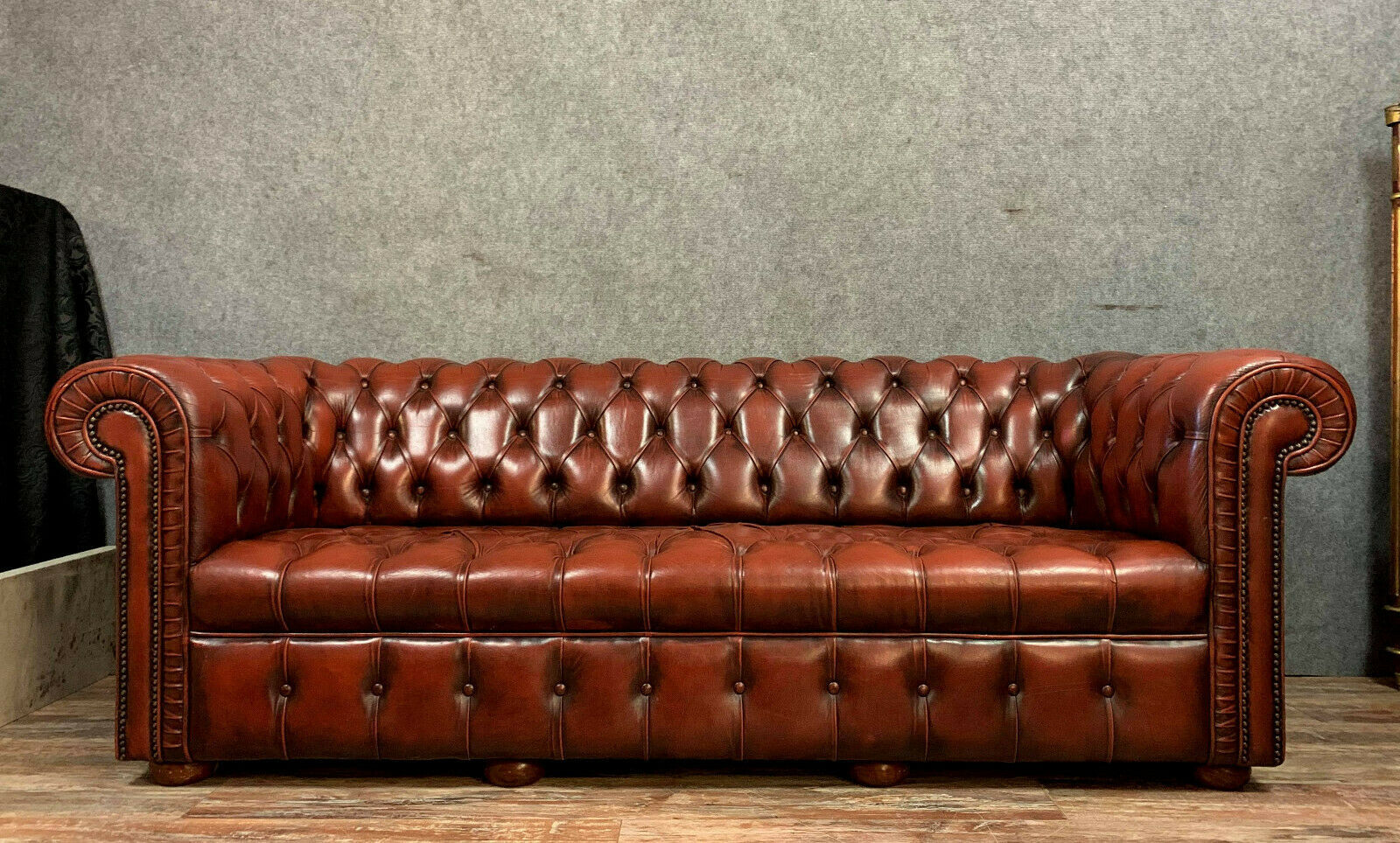 Chesterfield sofa in burgundy upholstered leather circa 1920
