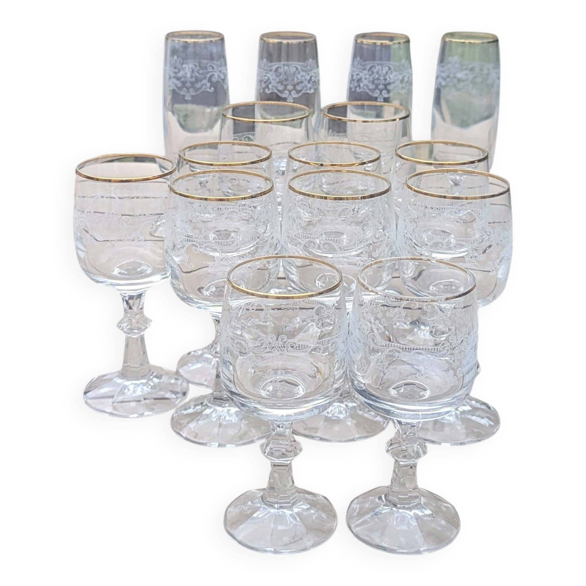 Set of 15 engraved crystal glasses with a gold rim.