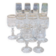 Set of 15 engraved crystal glasses with a gold rim.