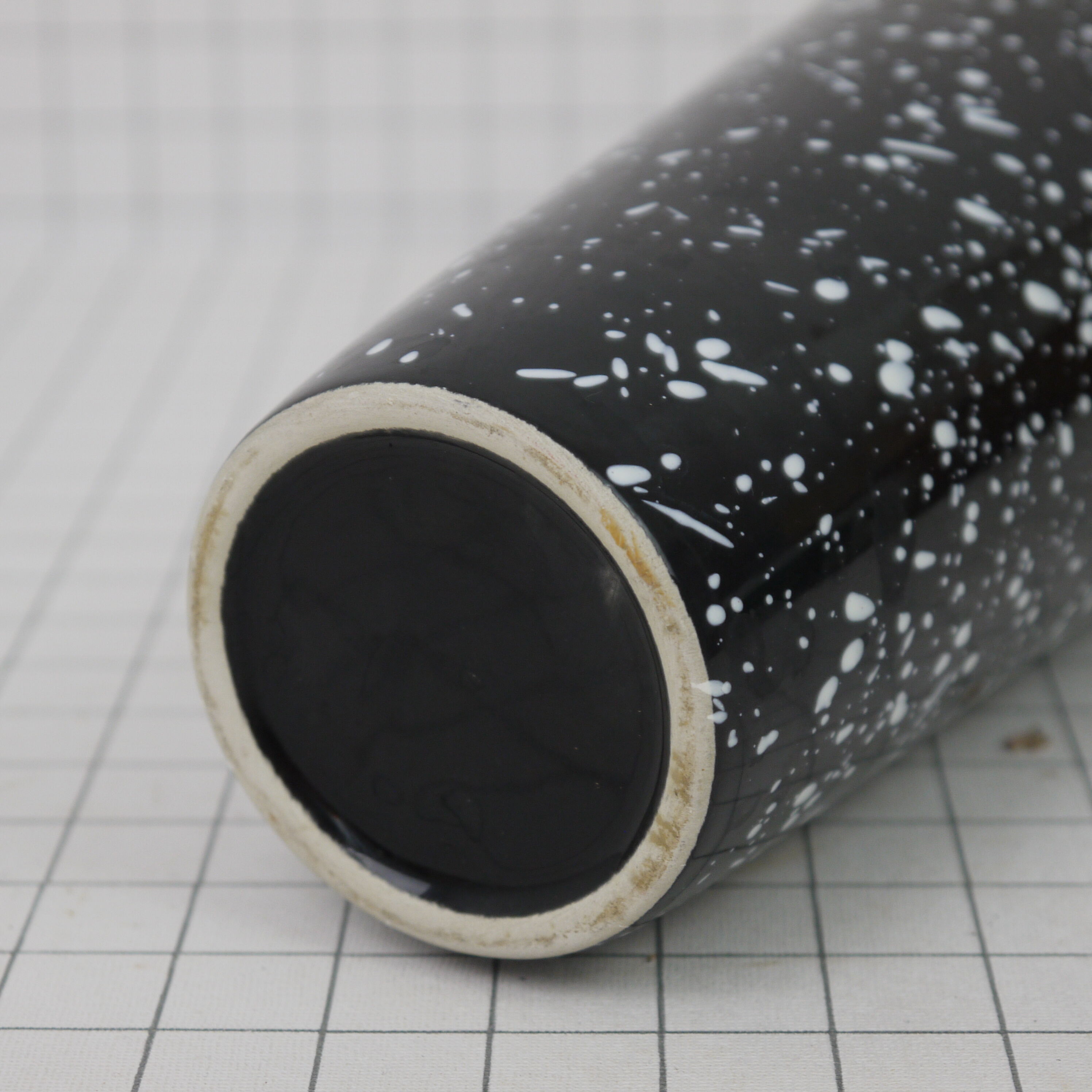 Black and white speckled vase