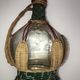 CASTAGNON glass carafe covered with wicker with music box