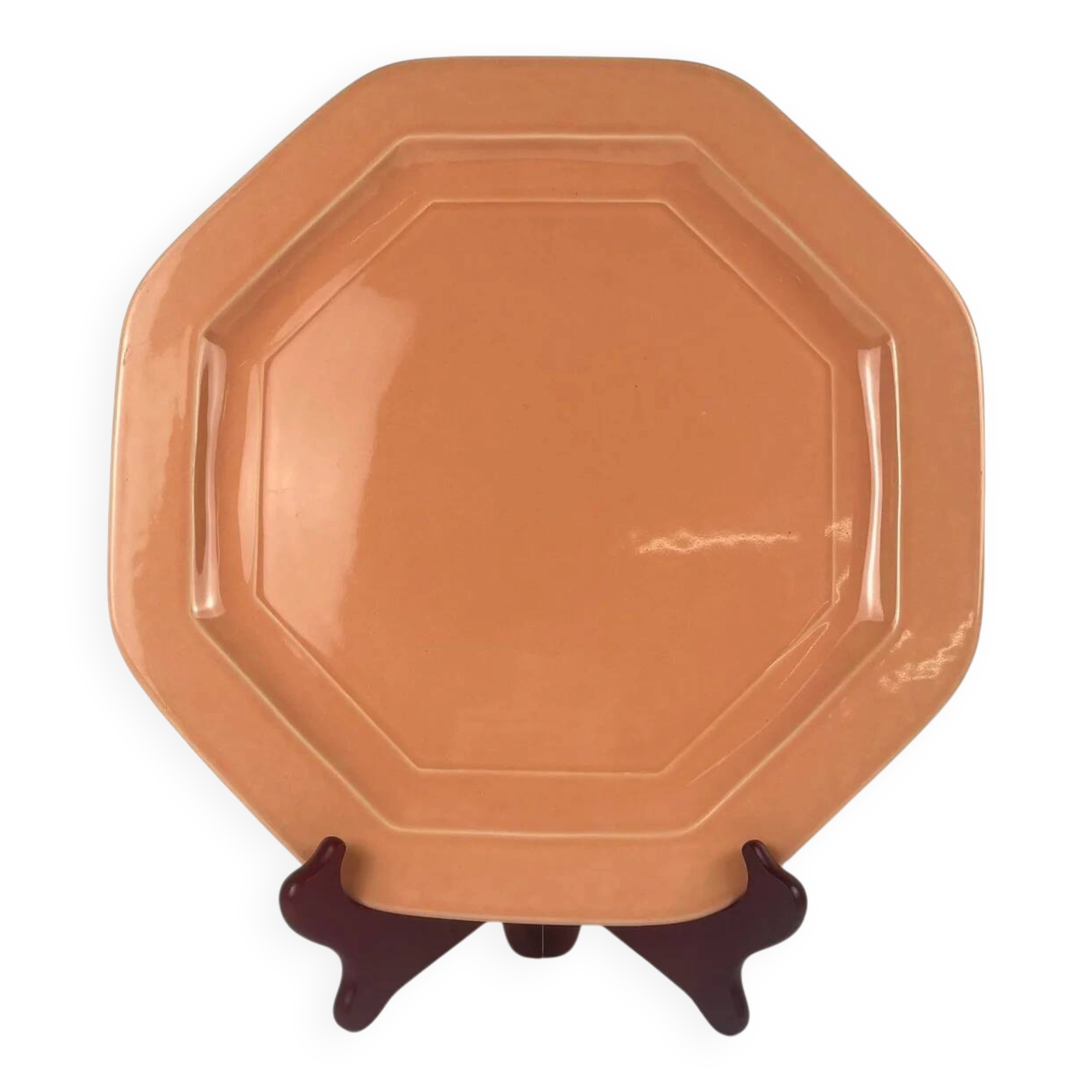 Octagonal plate in salmon pink, iron earth, Pagnossin, Italy, 20th century.