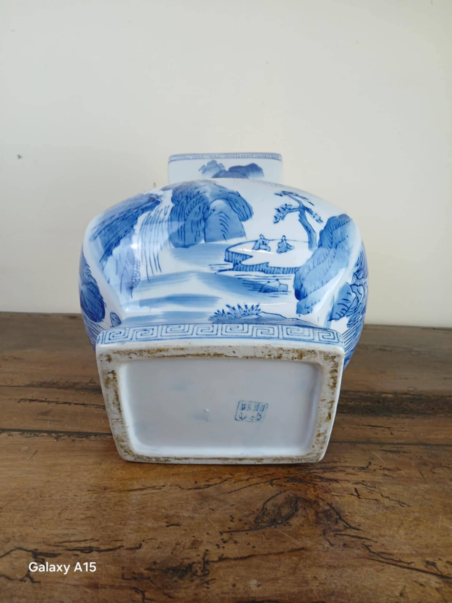 China circa 1920: porcelain vase with blue and white decoration