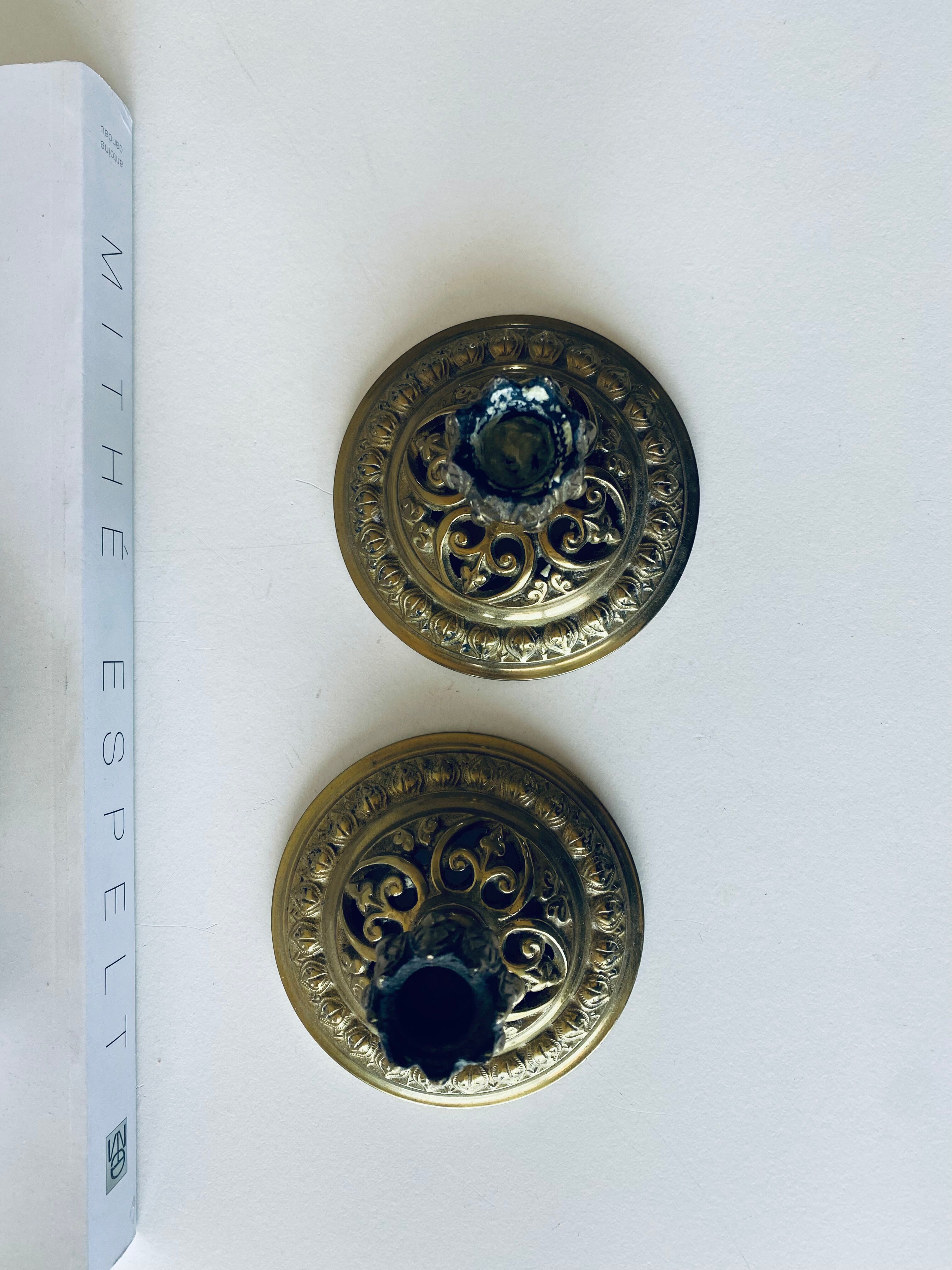 Pair of bronze candle holders signed