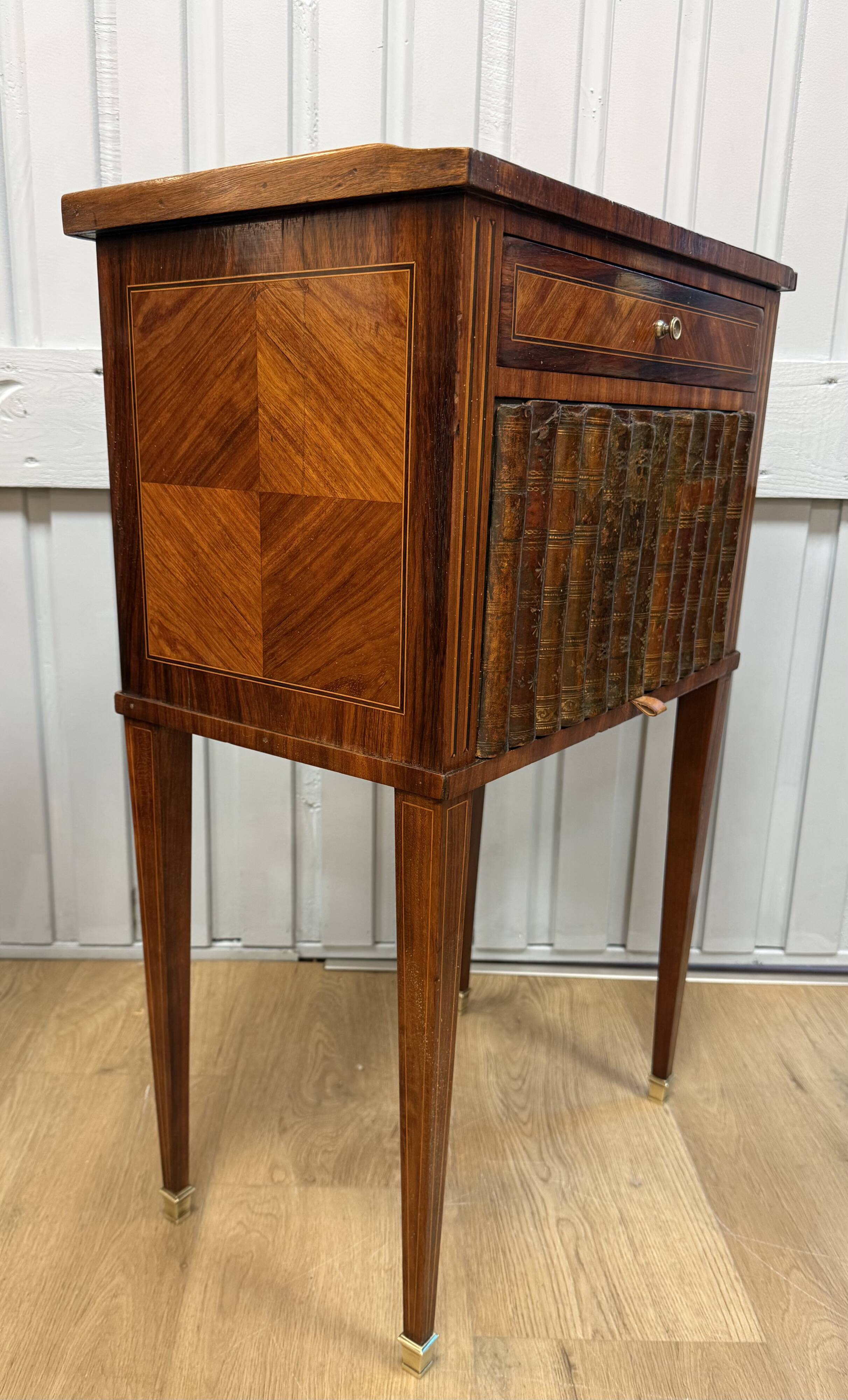 Side table with a faux book front.