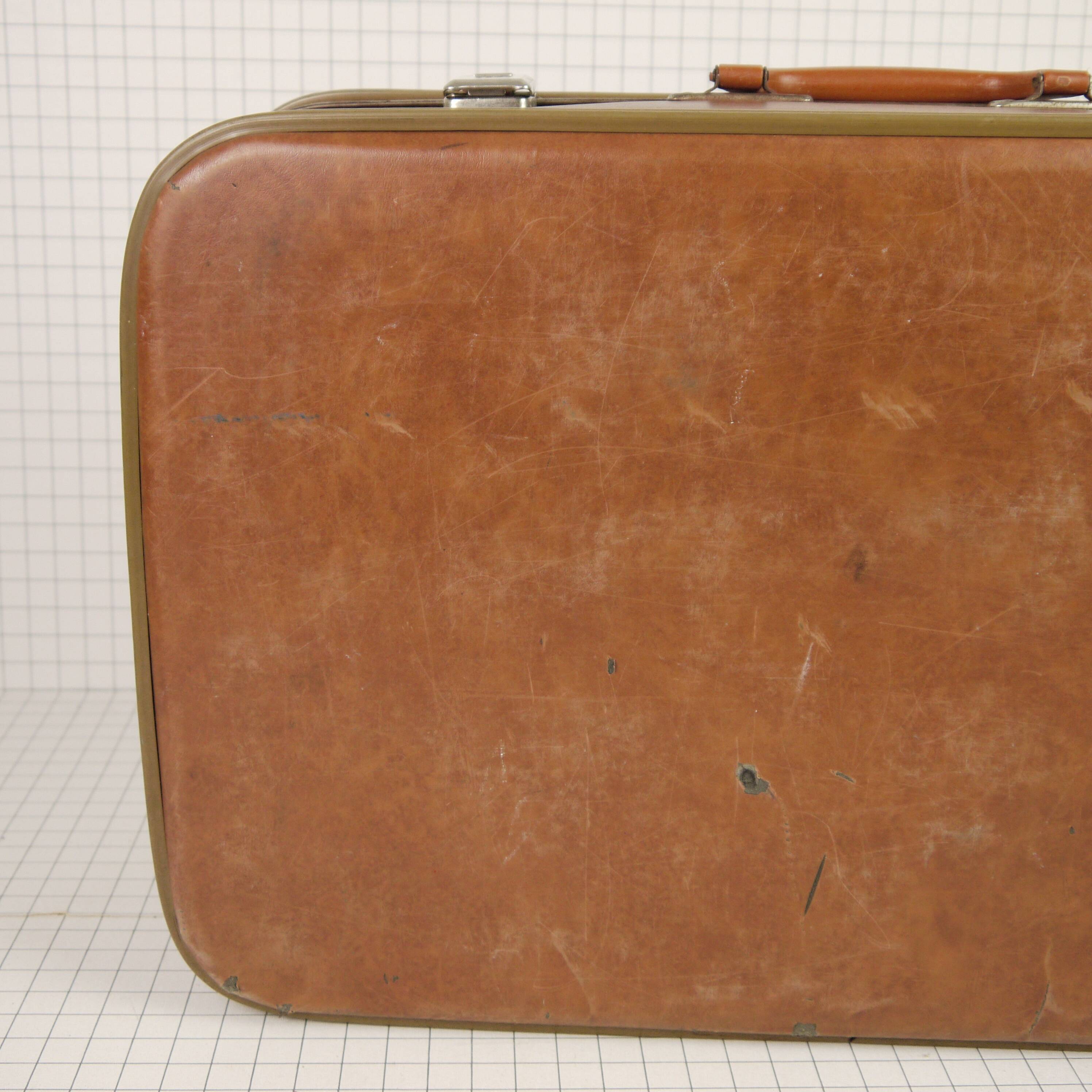 Cardboard and brown leather case