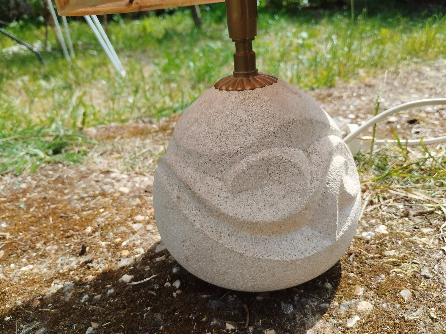 Vintage antique lamp with a stone base.