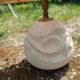 Vintage antique lamp with a stone base.