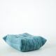 Ensemble de fauteuil et pouf Togo en velours côtelé bleu clair.