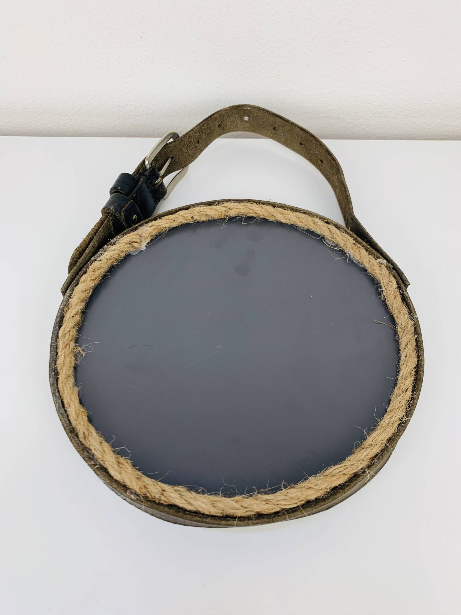 Mirror with handmade leather strapping