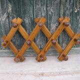 Old accordion coat rack