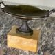 Bronze cup on a yellow Siena marble base, early 19th century.