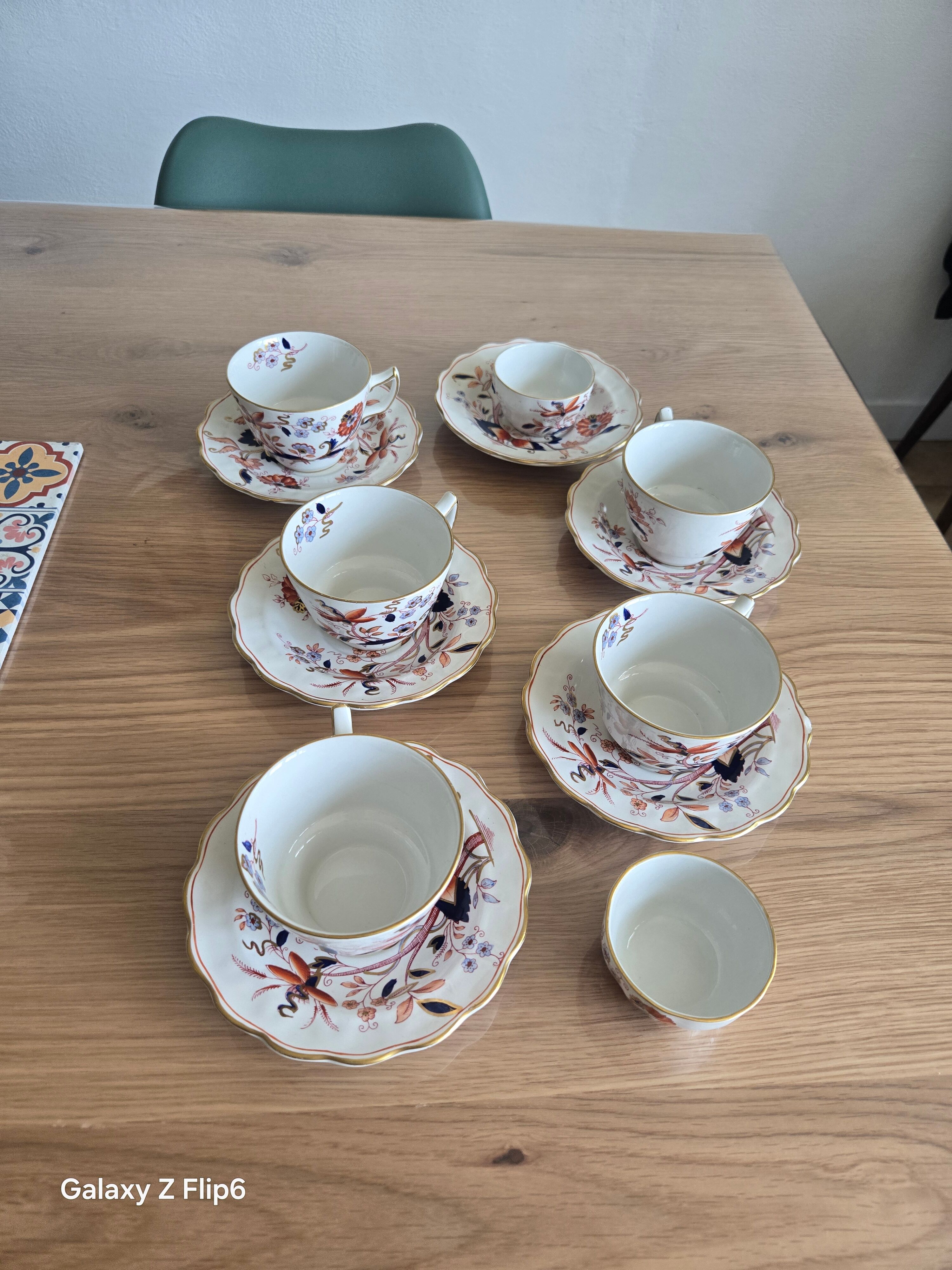 5 tea cups with saucers and 2 small pots, made in England.