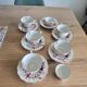 5 tea cups with saucers and 2 small pots, made in England.