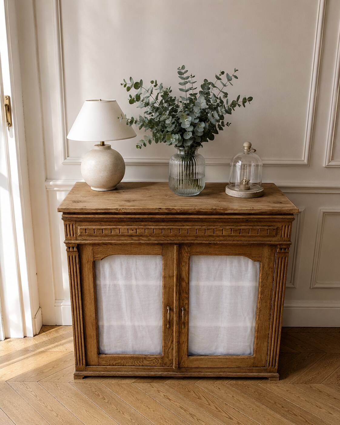 Antique wooden sideboard, fabric doors and pearl grey shelves.