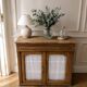 Antique wooden sideboard, fabric doors and pearl grey shelves.