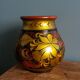 Khokhloma vase, Russian lacquered wood craftsmanship, hand-painted floral decoration.