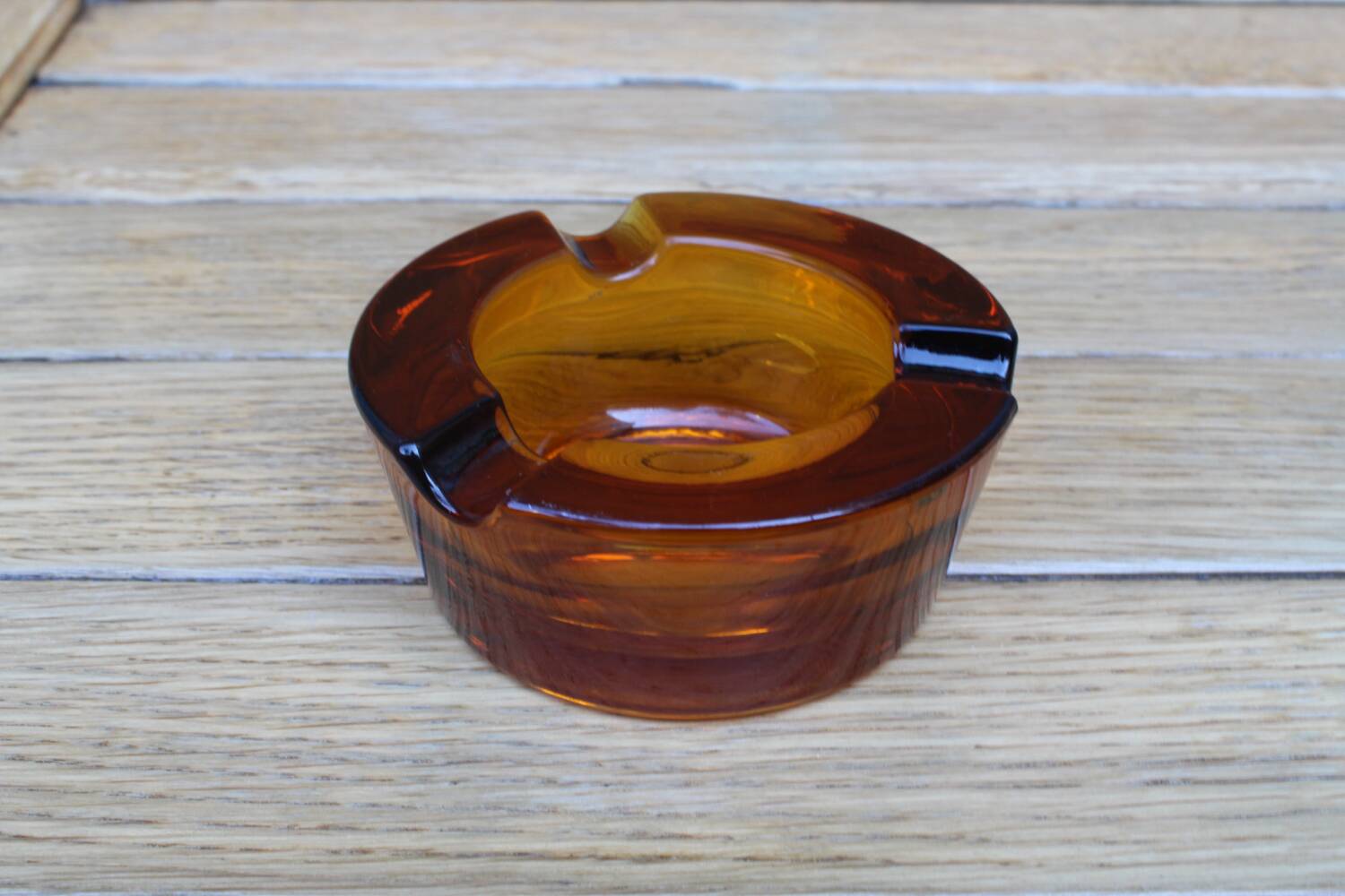 Amber glass ashtray