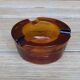 Amber glass ashtray