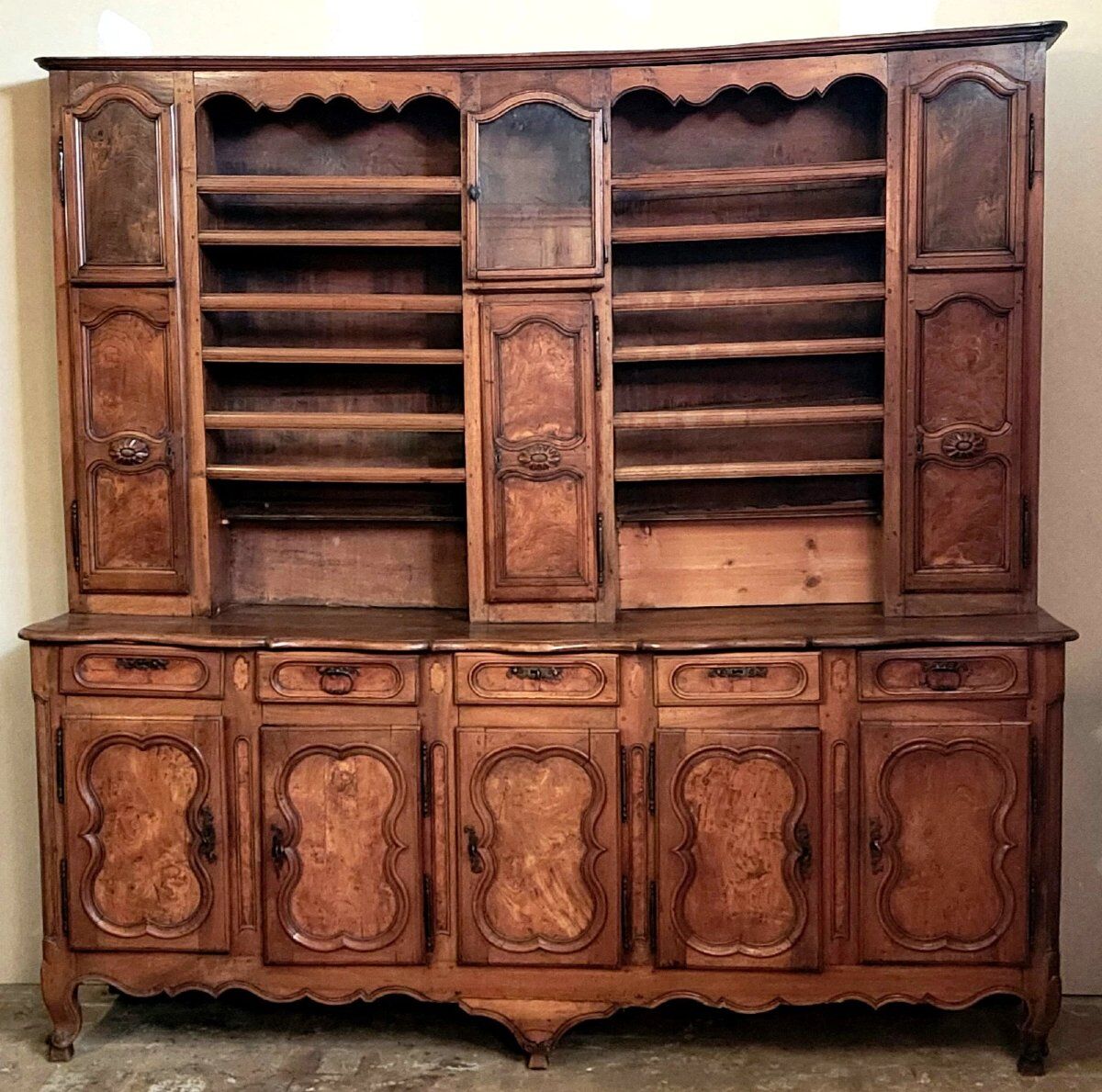 Clockside cabinet from the Louis XV period in walnut and elm, fully carved.