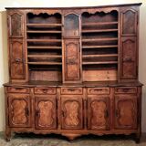 Clockside cabinet from the Louis XV period in walnut and elm, fully carved.