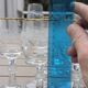 Set of 15 engraved crystal glasses with a gold rim.