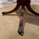 Vintage octagonal gueridon, 4 drawers, leather top, lion's paw feet.