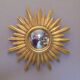 Sun mirror in golden resin from the 70s
